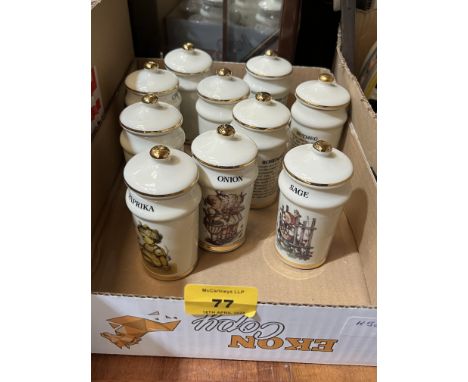 A set of ten small ceramic herb and spice jars, to include contents in sealed bags.