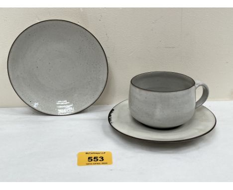 * DAME LUCIE RIE, AUSTRIAN 1902-1995. A coffee cup and two saucers. White stoneware with manganese rims. Impressed artist's s