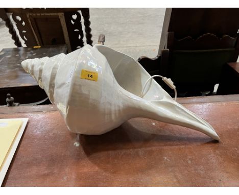 A shell form table lamp. 24" long.