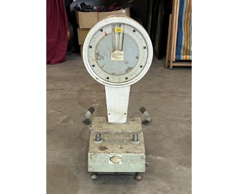 A set of shop weighing scales. 31" high.