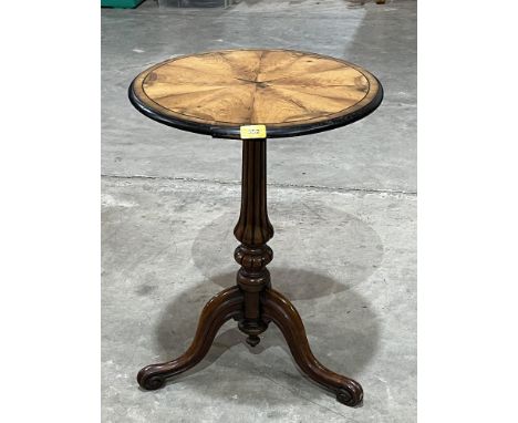 A Victorian walnut lamp table on tripod support. 17" diam