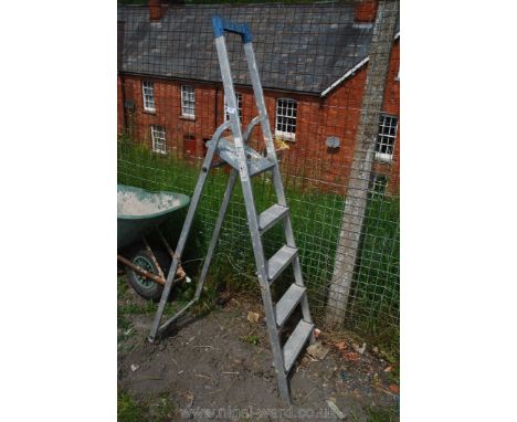 A four ring aluminium step ladder.