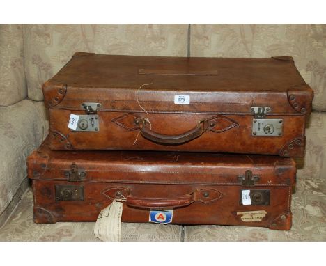 Two leather suitcases with old labels including B.- R. Southern region. cabin number, etc.,