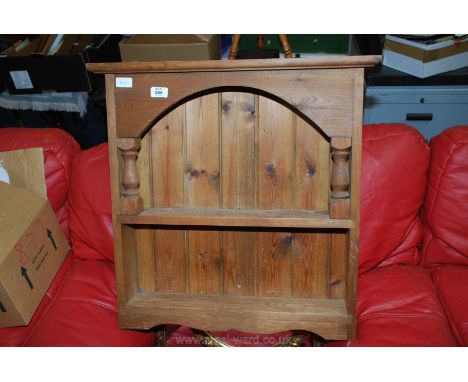 A two shelf pine kitchen spice rack.