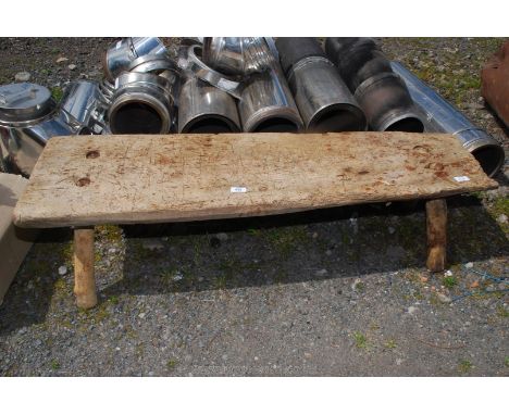 A Primitive oak Pig Bench, 38'' long, 14'' tall, depth varying from 12'' - 16''. (off farm condition)
