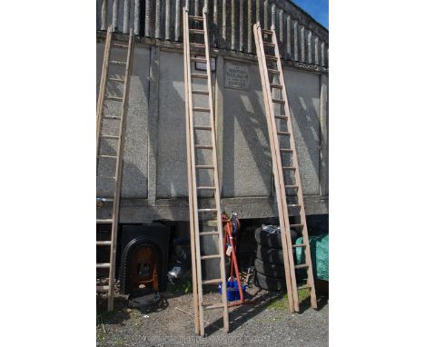A sixteen rung single extension wooden Ladder.