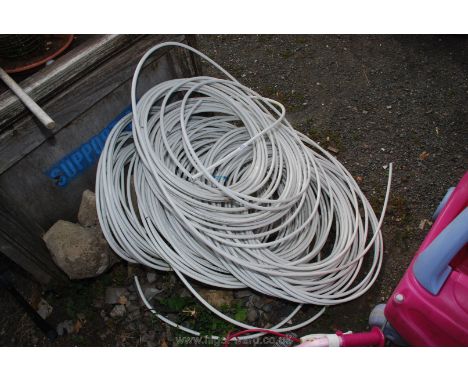 Several coils of underfloor heating pipe.