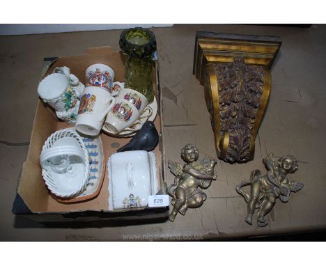 A box of commemorative ware including cherubs, vases, wall bracket etc.