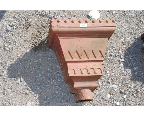 A large cast rainwater hopper.
