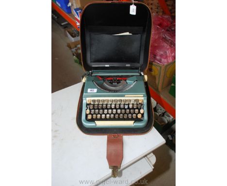 A cased portable typewriter.