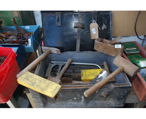 A metal box containing marking gauge, mallet, planes, tools etc.