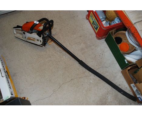 A petrol Chainsaw MT9999 with extended exhaust.