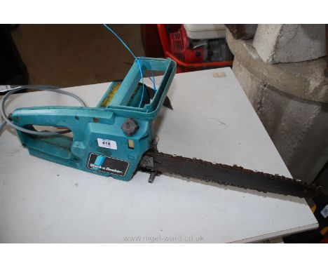 A Black &amp; Decker electric Chainsaw.
