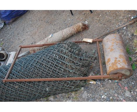 A long handled, 18 1/2'' x 10'' diameter Garden Roller.