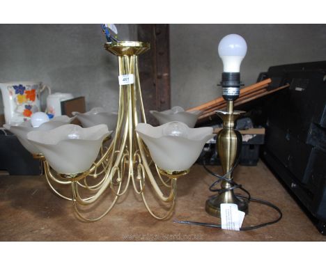 A five branch light fitting and table lamp.