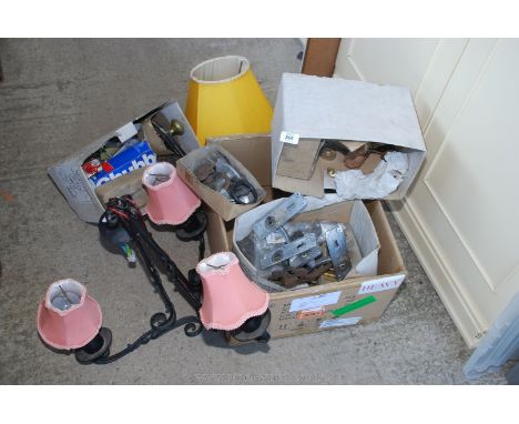 A box of door ironmongery and a wrought iron ceiling light.