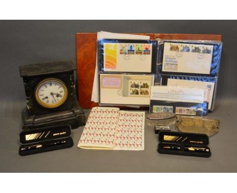 An Album of First Day Covers, a black slate mantel clock and other items 