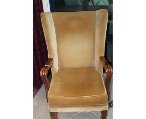 VINTAGE UPHOLSTERED ARMCHAIR 
together with a cast iron electric standard lamp