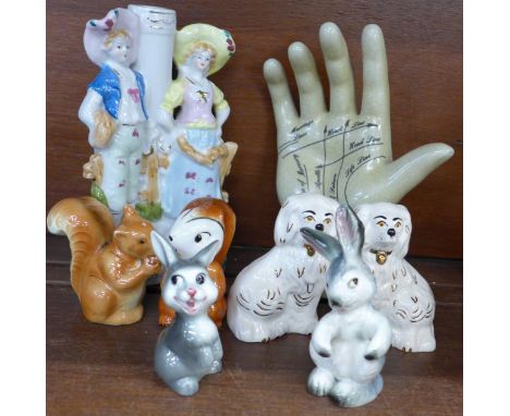 Two Royal Doulton miniature Staffordshire spaniels, two pairs of Goebel salt and pepper pots, spill vase and palmist's hand