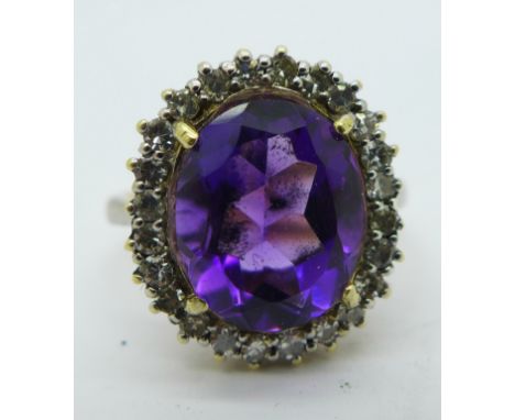 An 18ct gold, amethyst and diamond cluster ring, 4.3g, K