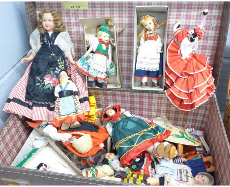 A case of approximately thirty dolls including five Chad Valley Wee-kin dolls and costume dolls