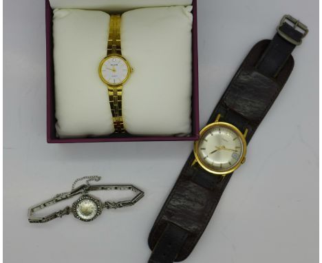 A lady's Accurist wristwatch, boxed, a silver and marcasite wristwatch and a Timex wristwatch