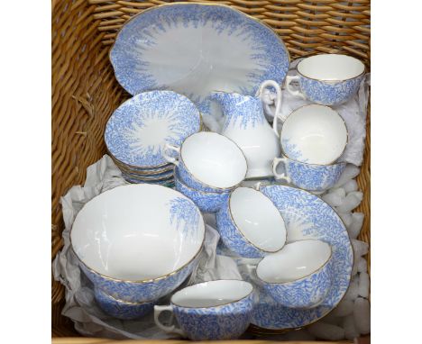 A twelve piece tea service in a wicker basket, 3841 mark to base
