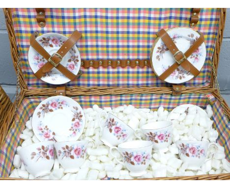 A Queen Anne bone china six setting tea set in a picnic hamper