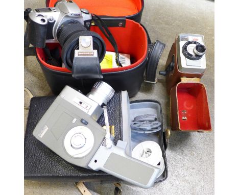 Two movie cameras, Kodak Brownie, Sabre EE zoom and a Canon EOS 500 camera, cased