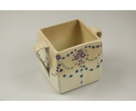 William Moorcroft for Liberty, a twin handled square form planter decorated in a Florian pattern against a pale ground, paint