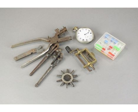 A collection of watchmakers tools, watch cases etc