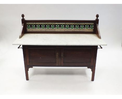 A late Victorian aesthetic movement marble topped wash stand with tile back decorated with snowdrops above two cupboard doors