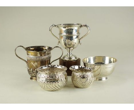 A Victorian silver two handled cup, Harrison Brother and Howson, Sheffield 1884, together with a silver two handled presentat