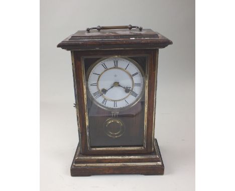 A Junghans rosewood effect mantel clock, the three gass case with brass swing handle, the white enamel dial with black Roman 