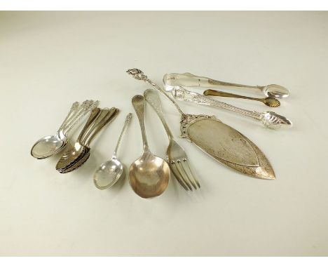 A pair of silver sugar tongs, together with a white metal cake slice, a silver dessert fork, a further pair of silver sugar t