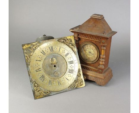 A box containing a 30 hour brass 10.5 inch clock dial with Roman numerals inset rolling moon phase and date aperture and insc