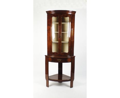 A Continental mahogany and boxwood strung bow front two door glazed corner cabinet and associated stand with false frieze dra