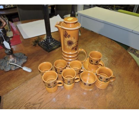 A Carltonware coffee service for six place settings, including coffee jug, sucriere, milk jug, mugs and saucers, of ribbed fo