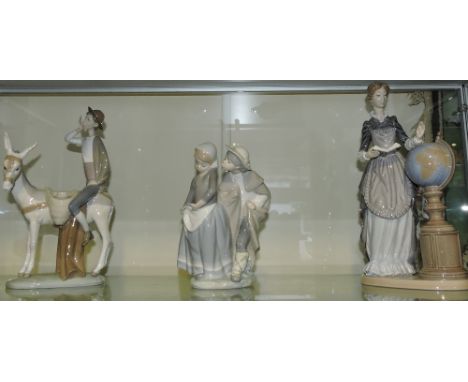 Three Lladro porcelain groups, including Maestra de Antano.