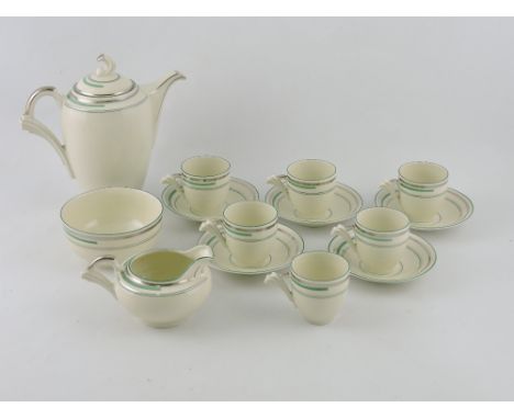 An Art Deco coffee service for six place settings, with silver and sage green line decoration, comprising coffee pot, sucrier