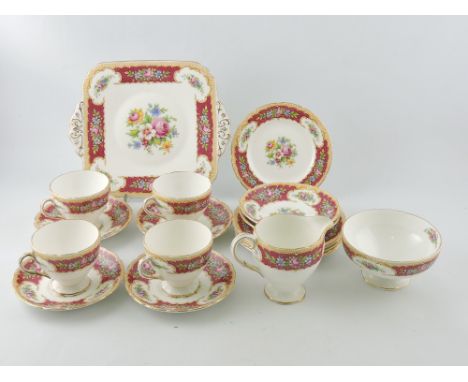 A Foley bone china part tea service, Tudor pattern, for four place settings, sugar bowl, milk jug and square sandwich plate.