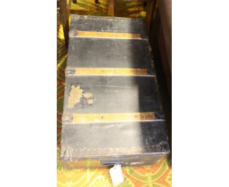 A Victorian metal mounted and wood bound steamer trunk.