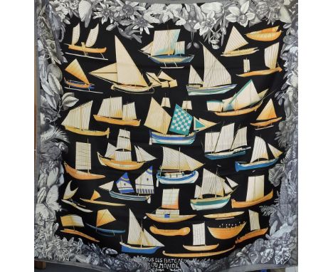 Hermes, Paris, silk, scarf Tous Les Bateaux Du Monde, decorated with boats on a black ground, 82cm x 85cm.