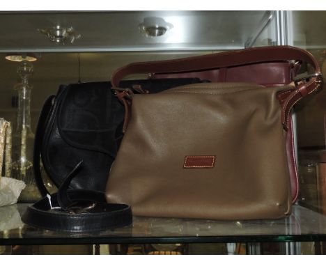 Christian Dior, Paris, a black leather handbag together with a Ralph Lauren burgundy bag and one other leather handbag.