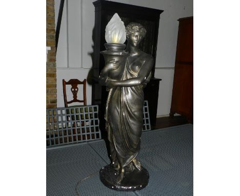 A cast plaster table lamp in the form of a classical figure holding a burning cauldron, H. 76cm. 