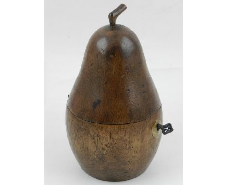 A fruitwood tea caddy in the shape of a pear. H: 18cm