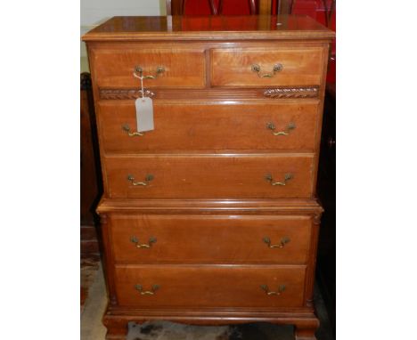 A 19th century style mahogany chest on chest, having two short above four long drawers, raised on carved bracket supports. H.
