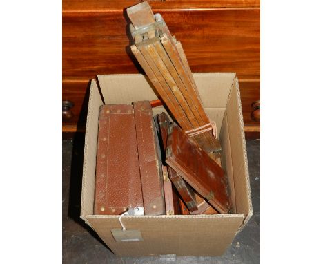A mahogany quarter-plate camera body with a quantity of slide backs, ash tripod and sundry associated items, (qty). 