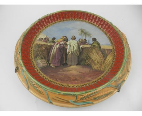 A 19th century Moroccan glazed ceramic wall charger, D. 15.5 cm. 