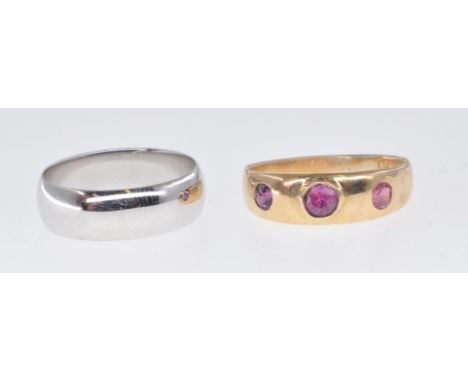 Two gold rings to include an antique Victorian / Edwardian 9ct gold gypsy ring set with three round cut pink stones (hallmark